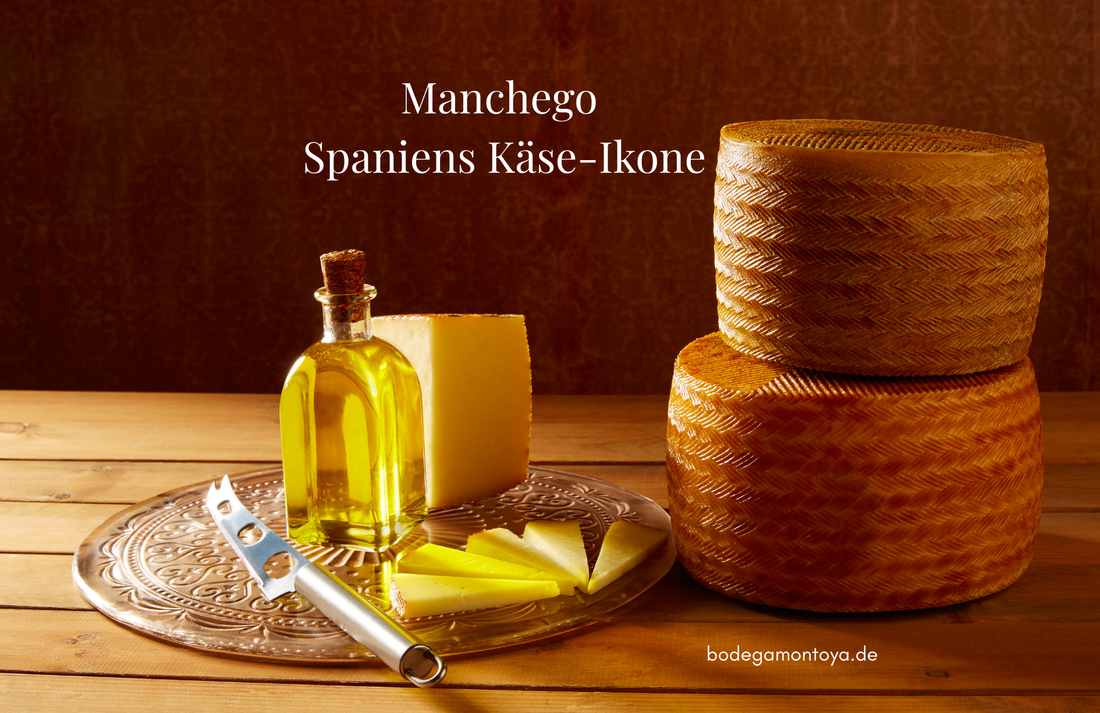 Spanischer Manchego-Käse als ganzes Käserad und in Scheiben. In Szene gesetzt mit einem Olivenöl.
